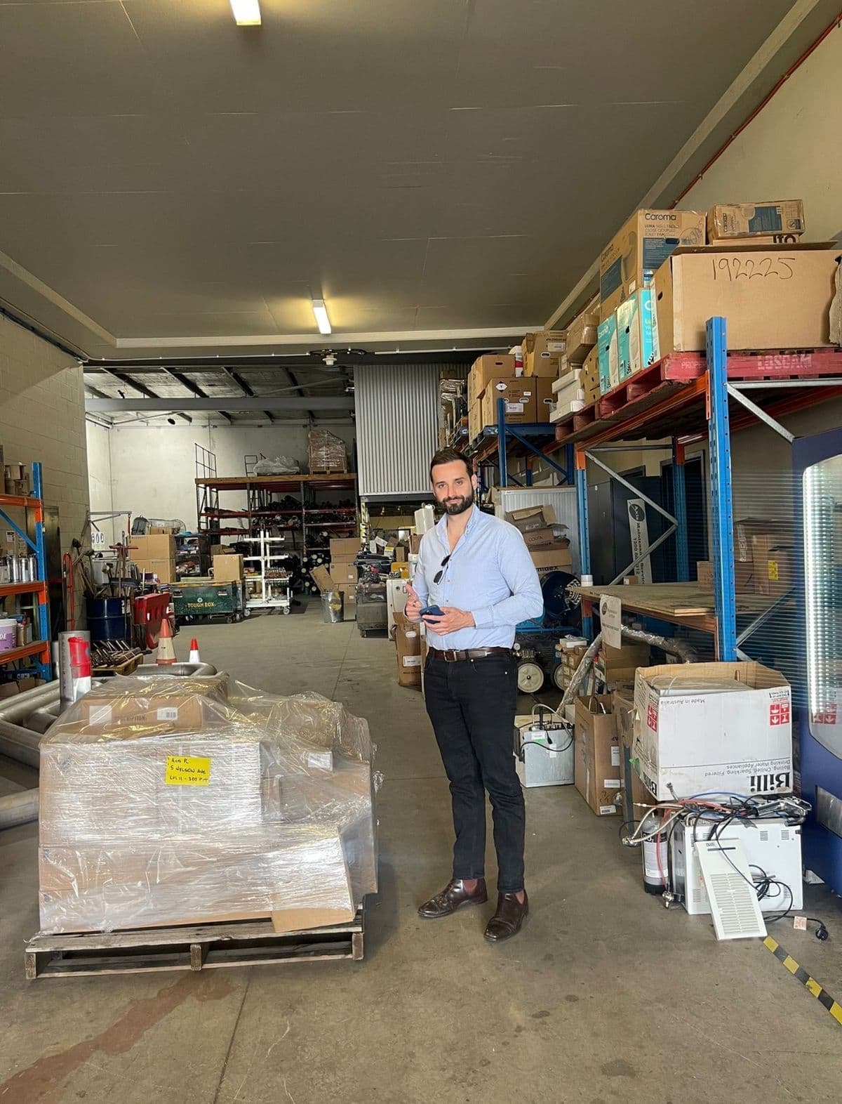 Jarrod Milford scanning assets in a customer warehouse