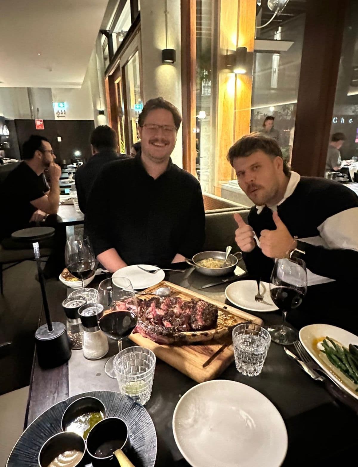 MapTrack founders celebrating over dinner